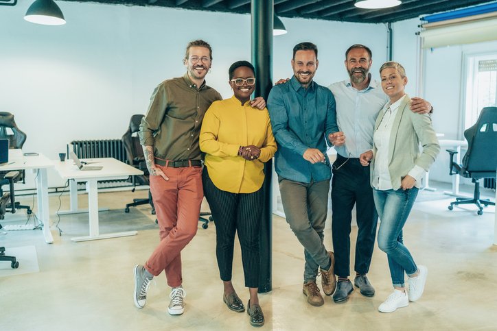 Organizations - image of a diverse designers smiling in their office