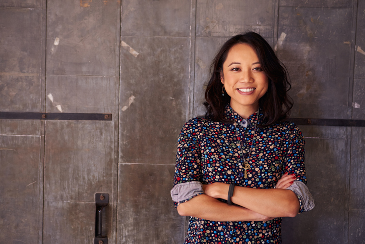 Individuals - image of a female designer against a slate tile background